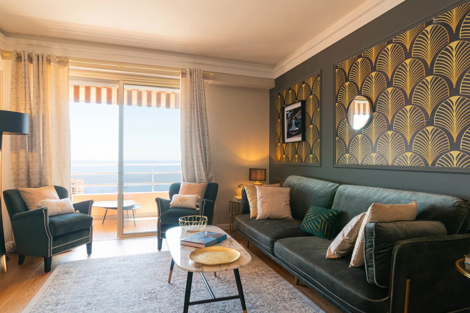 Art deco living room opening to balcony with Mediterranean sea view